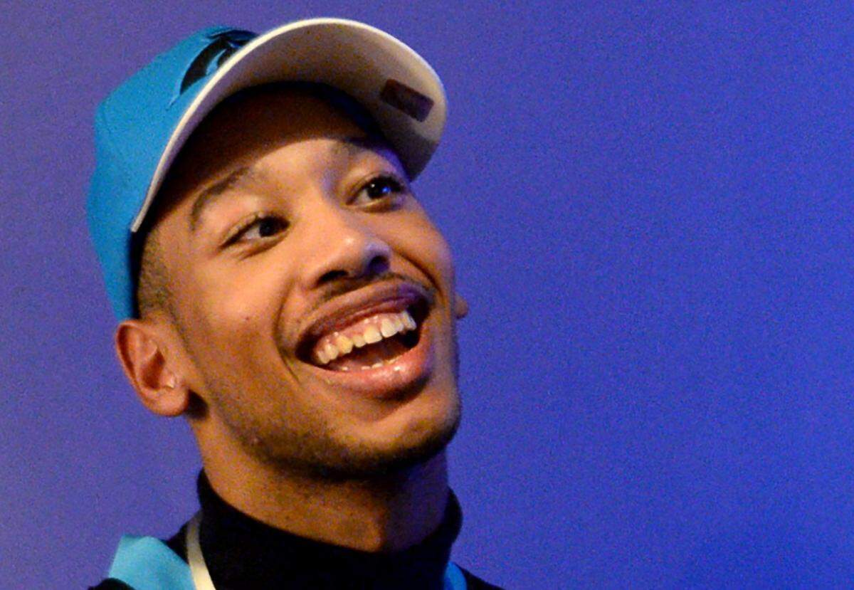 Chancellor Lee Adams smiles as he enjoys the festivities of a Roaring Riot pep rally at Banking Hall in London, England on Friday, October 11, 2019.