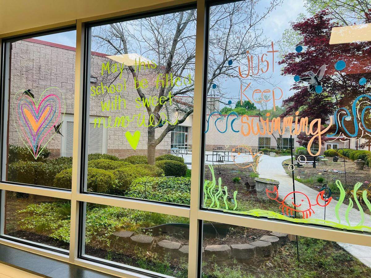 Positive messages painted on Fairview Elementary School after a student died. PTO members were told memorials are not allowed at the school.