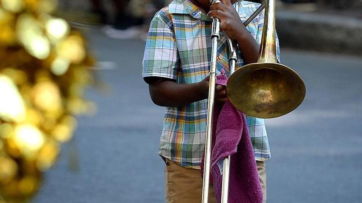 Maurice Torrence Jr., 4, marches with the United House of Prayer for All People Bailey Master Brass Band during the Charlotte Labor Day Parade on Monday, September 5, 2016.