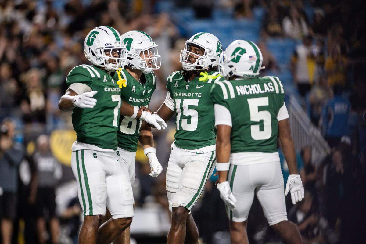 Charlotte 49ers celebrate a touchdown against the Appalachian State Mountaineers during the Duke's Mayo Classic at the Bank of America Stadium in Charlotte, N.C., on Friday, August 29, 2025.