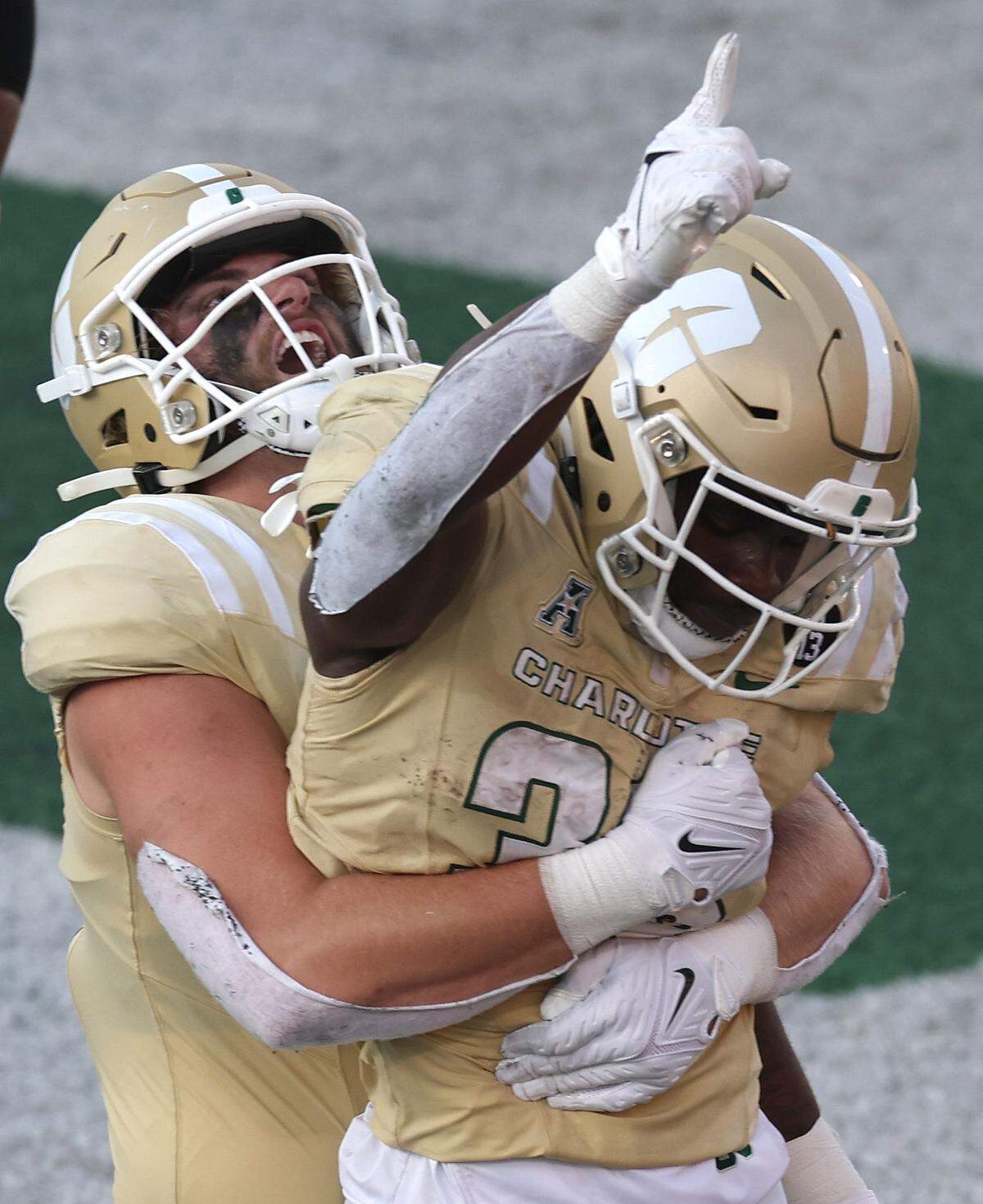 Charlotte 49ers tight end Colin Weber, left, congratulates running back Hahsaun Wilson on his touchdown run during fourth quarter action against the East Carolina Pirates on Saturday, October 5, 2024 at Jerry Richardson Stadium in Charlotte, NC. The 49ers defeated ECU 55-24.