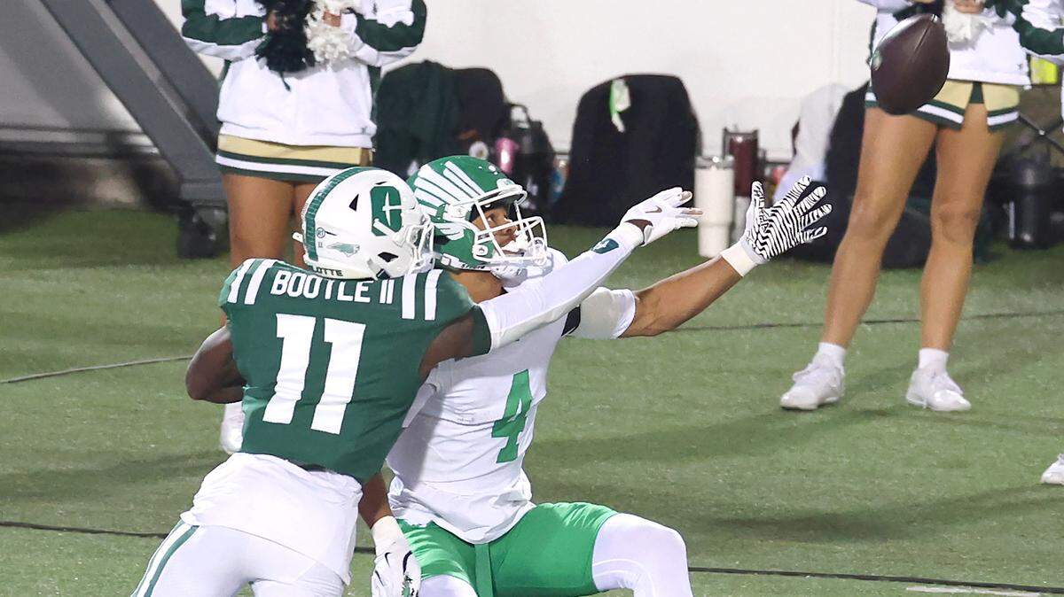 Charlotte 49ers defensive back Dwight Bootle II, left, is unable to stop North Texas wide receiver Cameron Dorner, right, from catching a one-handed touchdown pass during action on Friday, October 24, 2025 at Jerry Richardson Stadium.