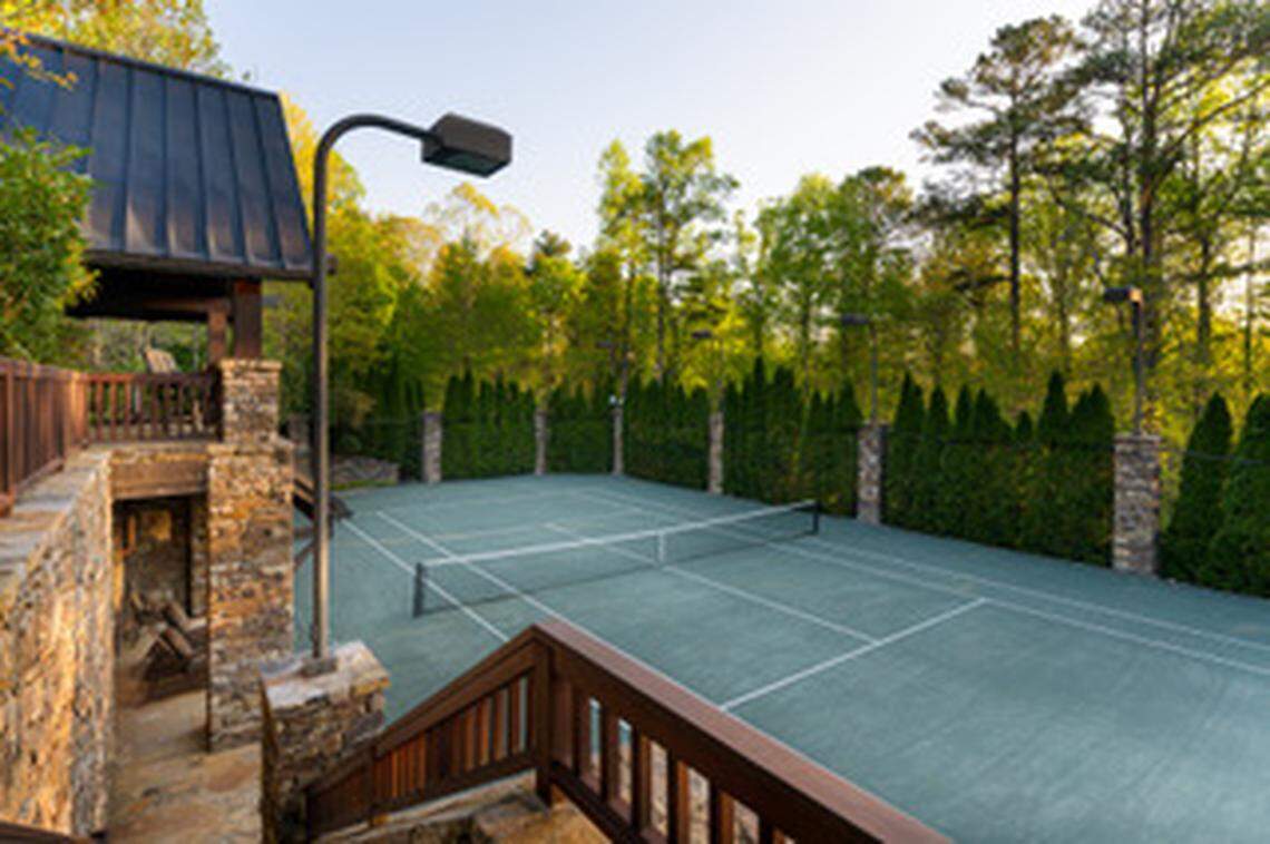 Set on more than five private acres, the estate features award-winning gardens, cascading waterfalls, wooded trails and a world-class Har-Tru tennis facility.