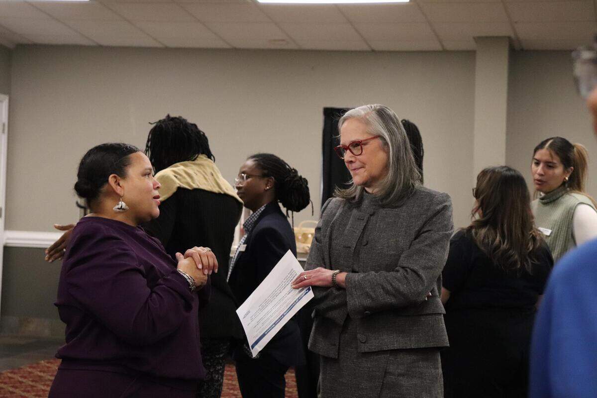 CMS Board of Education member Shamaiye Haynes, left, spoke with Kathryn Firmin-Sellers, president and CEO of United Way of Greater Charlotte, at a United Way partner event.