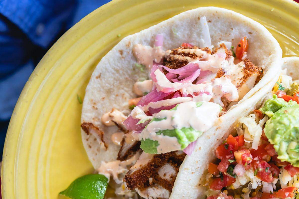 The chicken milanesa taco at Paco’s features crispy chicken, shredded cabbage, avocado, pickled onion, pico de gallo, cilantro and chipotle ranch, served on soft corn tortillas.