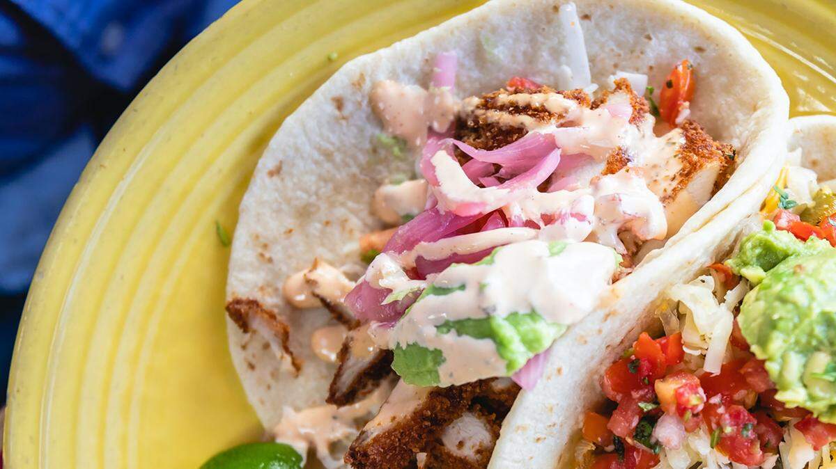 The chicken milanesa taco at Paco’s features crispy chicken, shredded cabbage, avocado, pickled onion, pico de gallo, cilantro and chipotle ranch, served on soft corn tortillas.