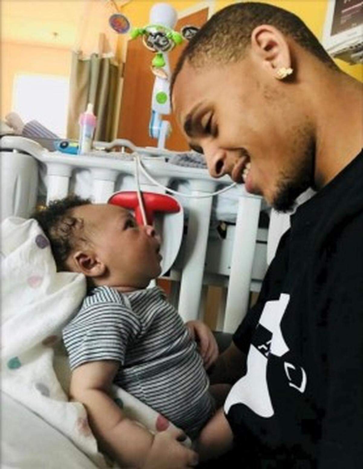 Armani Spencer, 23, shown with one of his three children in Mecklenburg County Superior Court documents, was killed in 2022. Spencer’s estate and Bianca Brown are suing Northlake Mall and Northlake Commons.