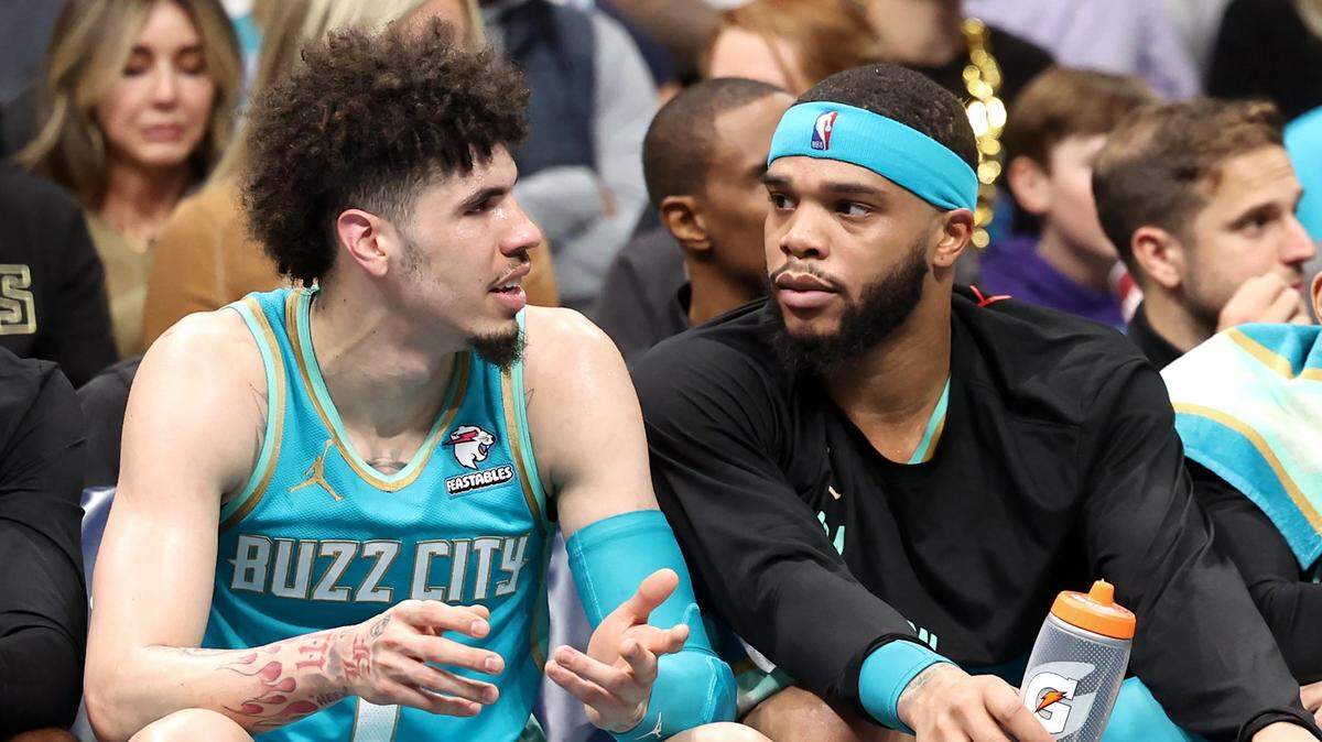 Charlotte Hornets guard LaMelo Ball, left, talks with forward Miles Bridges, right, during first half action against the Milwaukee Bucks on Friday, November 17, 2023 at Spectrum Center in Charlotte, NC.