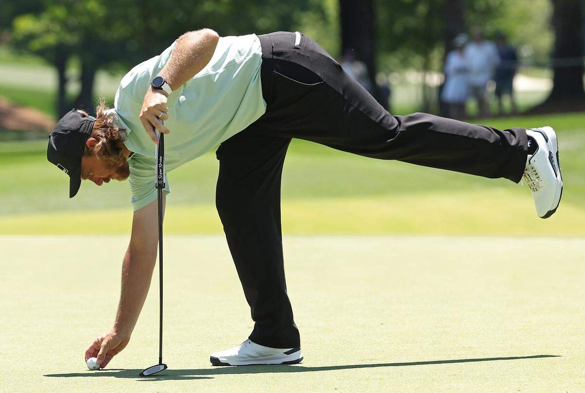 Tommy Fleetwood positions his ball prior to putting on the second green during the final round of the Truist Championship at Quail Hollow Club in Charlotte, NC on Sunday, May 10, 2026.