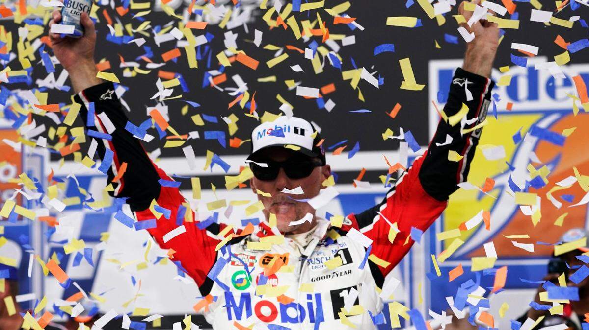 Kevin Harvick celebrates after winning a NASCAR Cup Series auto race at Richmond Raceway, Sunday, Aug. 14, 2022, in Richmond, Va. (AP Photo/Steve Helber)