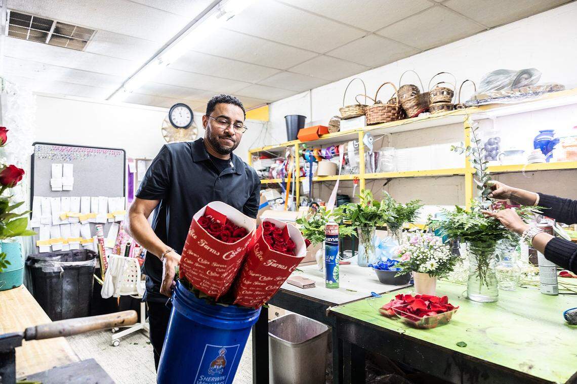 Neil Nevins works on flower arrangements for Valentine’s Day at Stroud Florist on Beatties Ford Road.