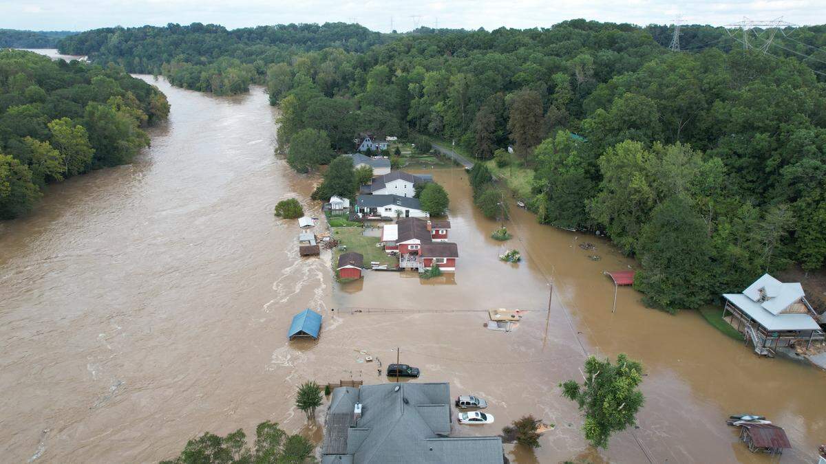 This image taken by a drone shows homes along the Catawba River submerged in floodwater from Helene. A number of homes saw roof-high flooding as water moved through the Catawba River system. Mark Thompson DroneFootage.Pro