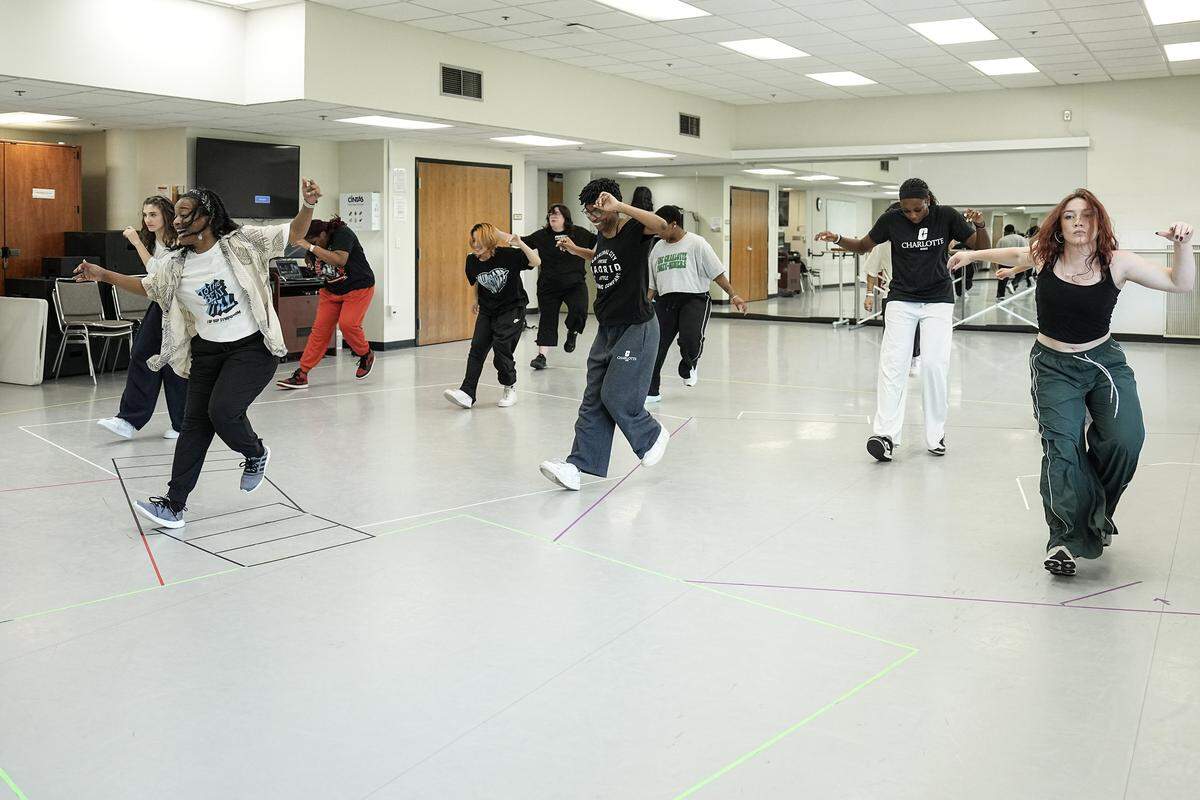 Assistant professor of dance Ashley Tate, front, teaches a dance routine ahead of the hip hop symposium she is producing at UNC Charlotte, Wednesday, Sept. 24, 2025, in Charlotte, N.C.
