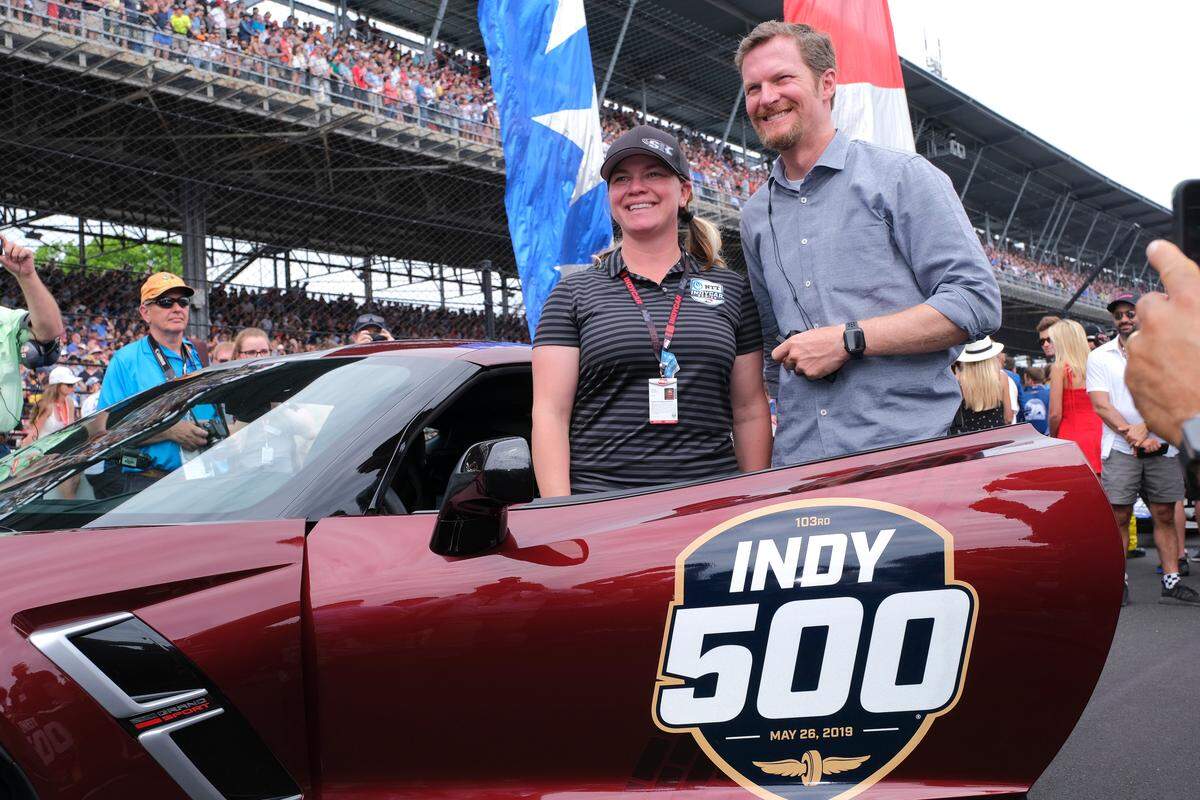 Dale Earnhardt Jr. poses with Sarah Fisher before driving the pace car to start the Indianapolis 500 IndyCar auto race at Indianapolis Motor Speedway, Sunday, May 26, 2019, in Indianapolis. (AP Photo/AJ Mast)
