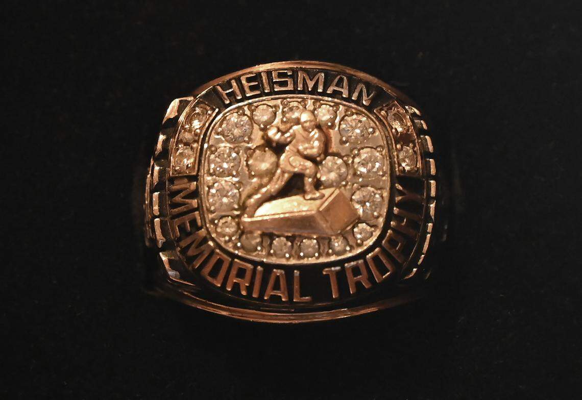 Former South Carolina Gamecocks running back and Heisman Trophy winner George Rogers Heisman Memorial Trophy ring is among Rogers’ mementos on Tuesday, May 23, 2023. Rogers won the Heisman in 1980.