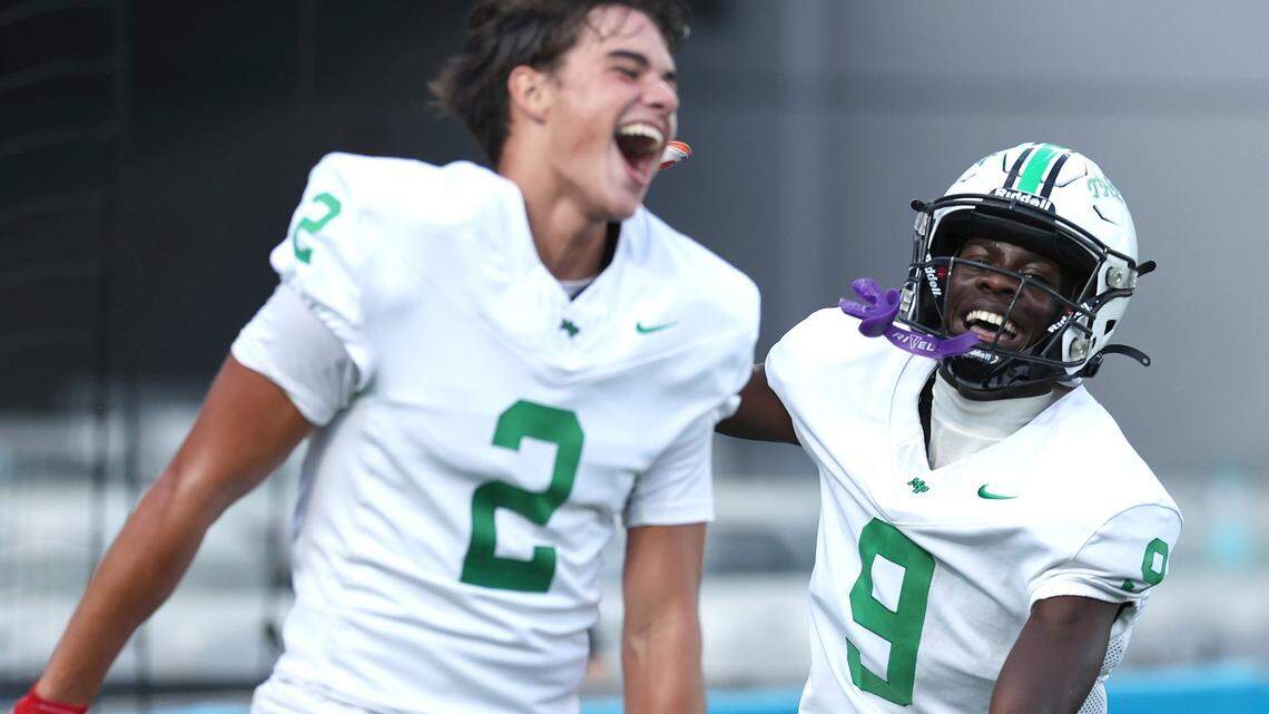 Myers Park wide receiver Brody Keefe, left and wide receiver Chaz Portis, right, celebrate Portis’  touchdown pass reception during late fourth quarter action against the Independence Patriots on Thursday, August 22, 2024 at Bank of America Stadium in Charlotte, NC. The teams are competing in the Keep Pounding High School Classic. Independence defeated Myers Park 24-21.