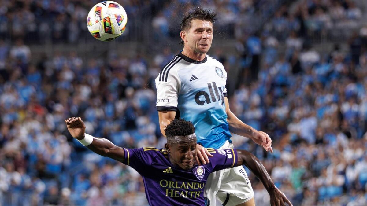 Charlotte FC’s Brandt Bronico (back) leaps over Orlando City defender Dagur Thorhallsson (front) for the header. Charlotte FC would host Orlando City in Game 2 of the MLS Playoffs Friday November 1, 2024.