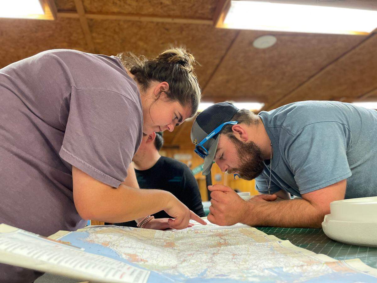Paige Roach, 28, shows volunteers which small Appalachian towns need the most help.