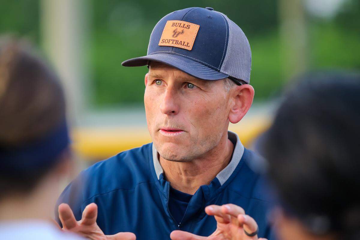 Hickory Ridge head coach Justin Davies gives his team a motivation speech after their first playoff win against Marvin Ridge