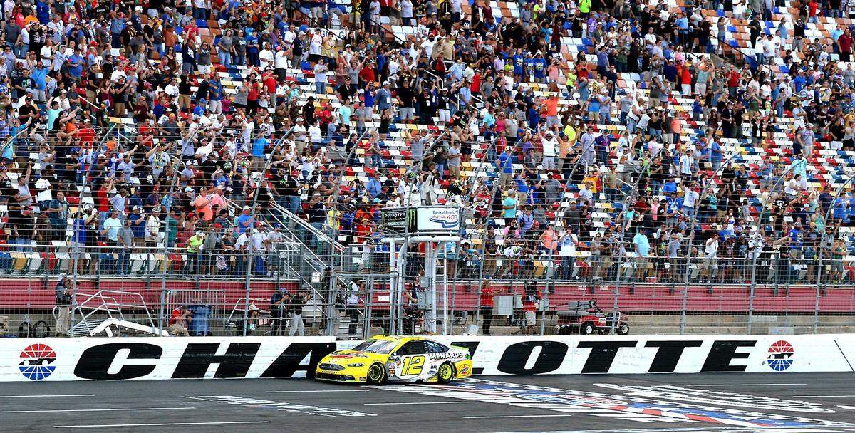 Ryan Blaney crosses the finish line at Charlotte Motor Speedway to win the 2018 Bank of America Roval 400.