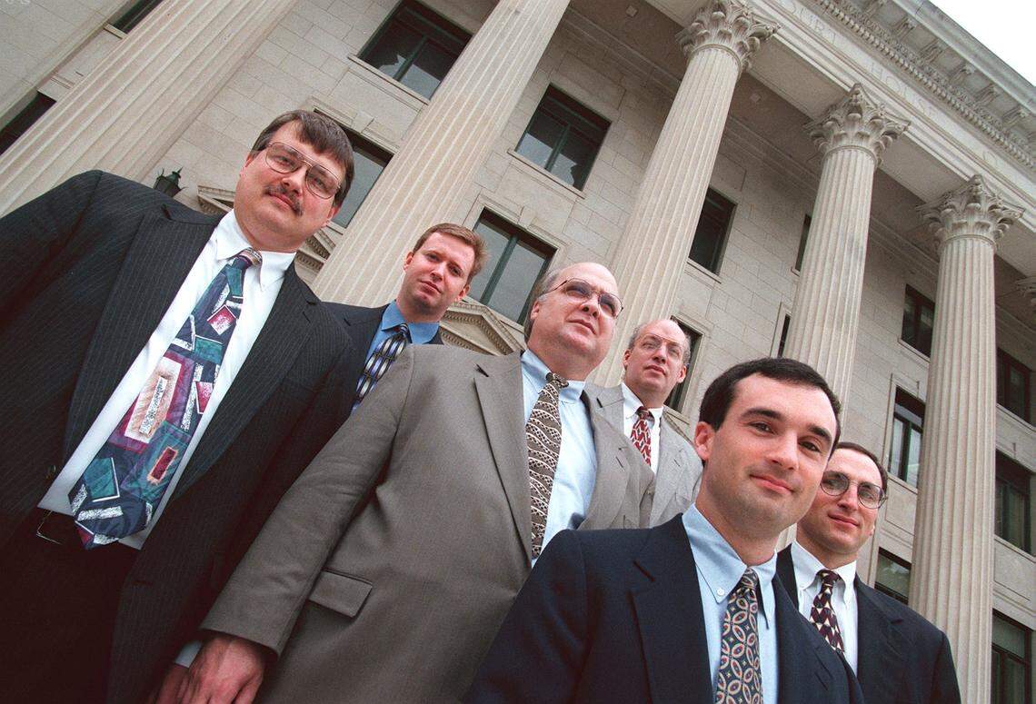 Members of the DA's office property crimes unit, from left, David Maloney, Eric Cottrell, Greg McCall, Nate Proctor, Glenn Cole III and Jay Ashendorf stand on the steps of the old courthouse in Charlotte. The unit handles burglaries and other property related crimes.