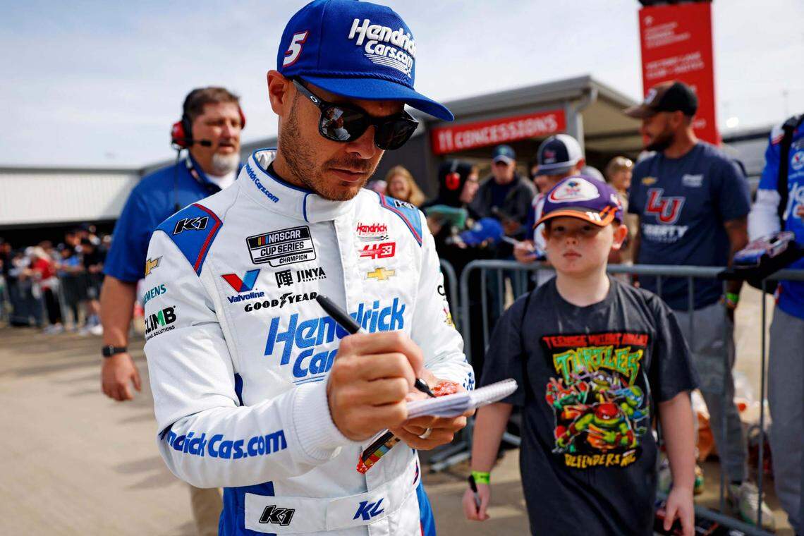 Mar 30, 2024; Richmond, Virginia, USA; NASCAR Cup Series driver Kyle Larson (5) signs autographs during practice for the Toyota Owners 400 at Richmond Raceway.