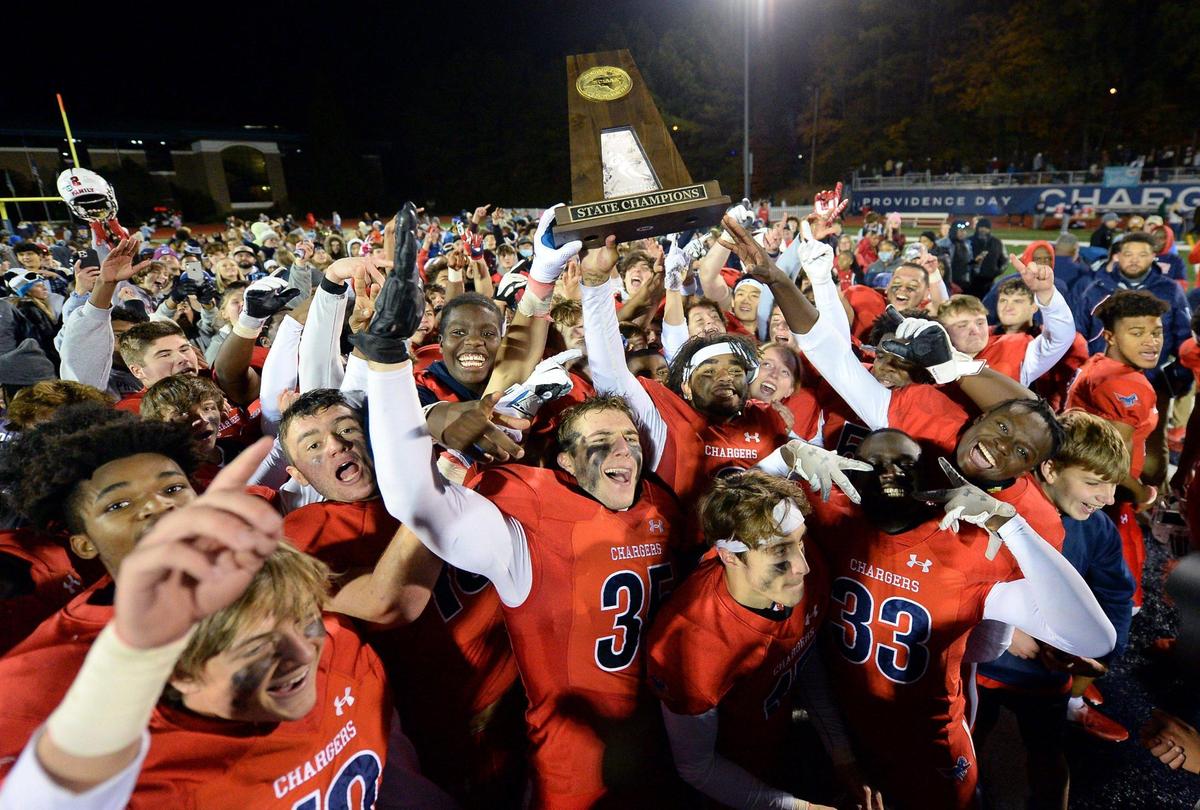 The Providence Day Chargers celebrate their 14-9 victory over Rabun Gap at Providence Day School in Charlotte, NC on Friday, November 19, 2021. The Chargers defeated Rabun Gap to win the NCISAA boys state championship game.