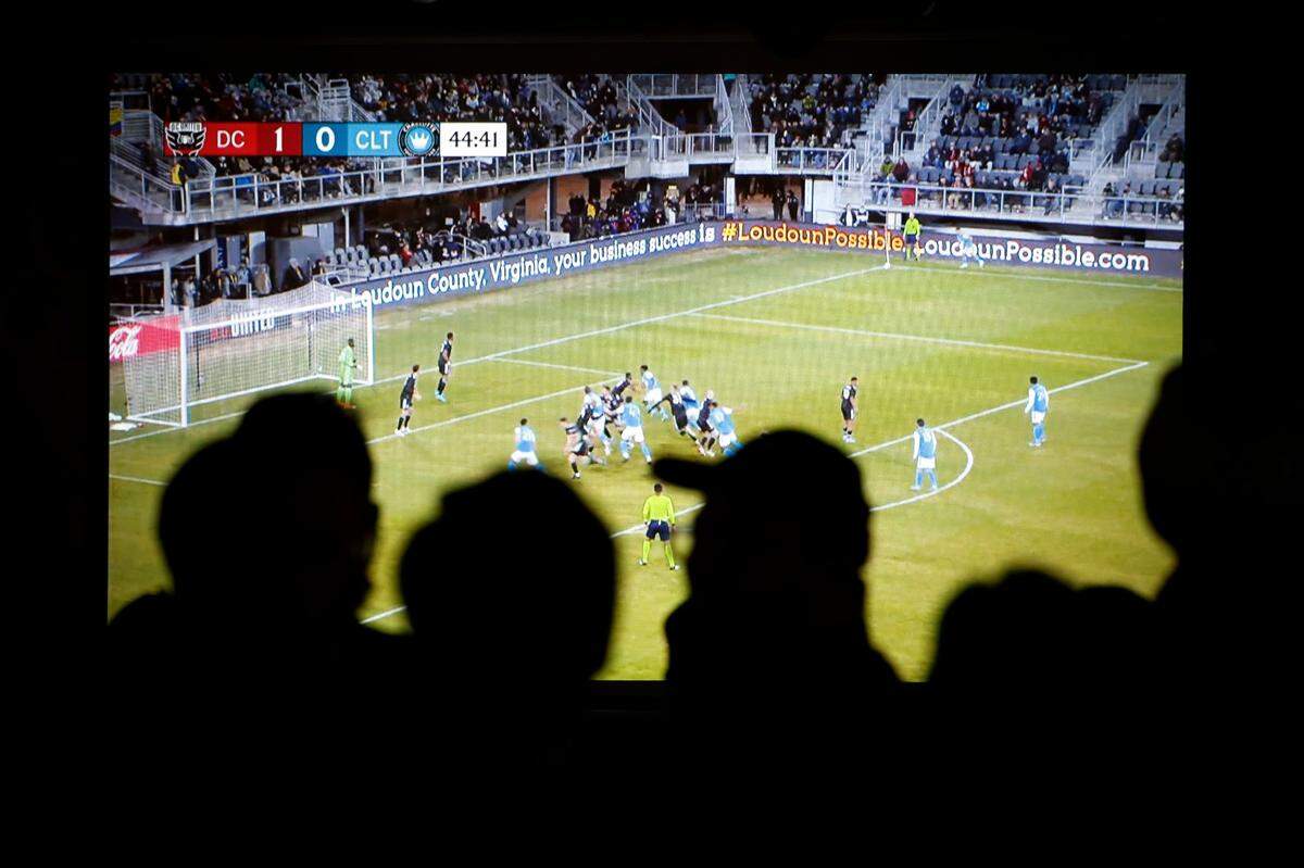 Charlotte FC fans watch as the team plays D.C. United during a watch party at Salud Beer Shop in Charlotte, Saturday, Feb. 26, 2022. D.C. United beat Charlotte FC 3-0 in what was Charlotte’s Major League Soccer debut.