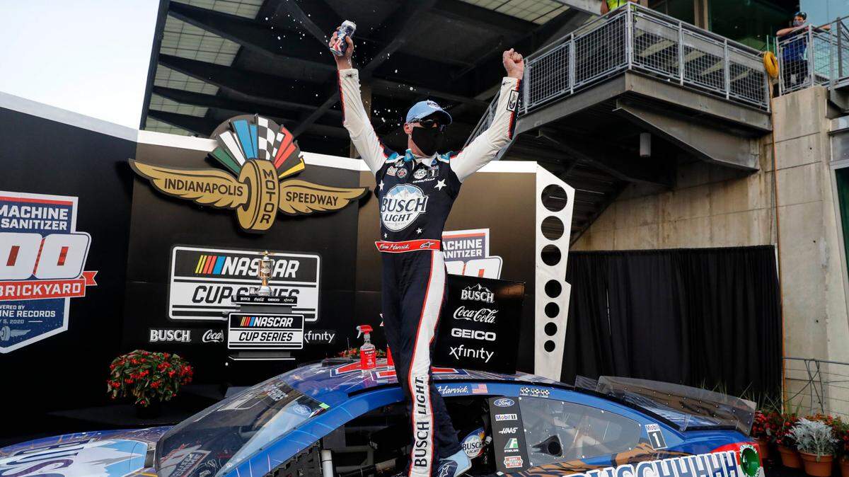 Race driver Kevin Harvick celebrates after winning the NASCAR Cup Series auto race at Indianapolis Motor Speedway in Indianapolis, Sunday, July 5, 2020. (AP Photo/Darron Cummings)