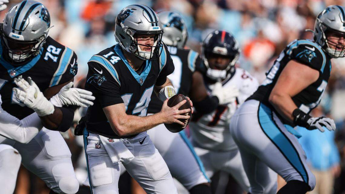 Carolina Panthers quarterback Sam Darnold (14) drops back to pass against the Denver Broncos at Bank of America Stadium in Charlotte, N.C., on Sunday, November 27, 2022.