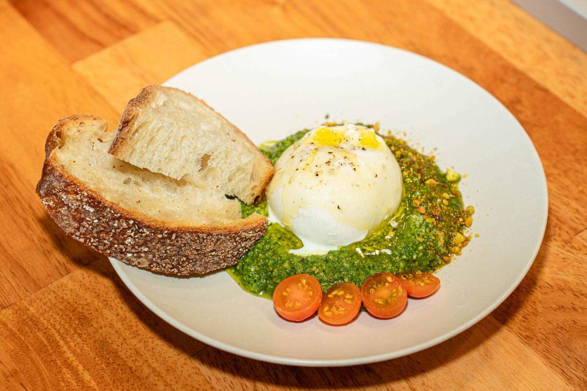 The Burrata appetizer has pistachio pesto and Sicilian olive oil.