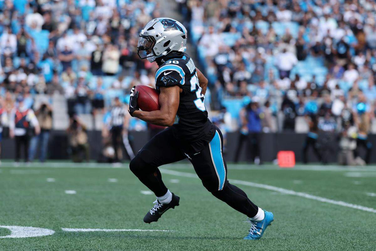 Chuba Hubbard of the Carolina Panthers returns a kickoff against the New Orleans Saints during the first half of Sunday’s game at Bank of America Stadium.