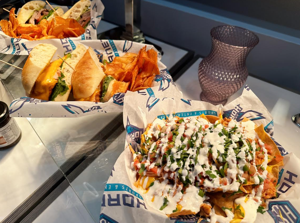 The super loaded nachos from NoDa Cantina and hand-carved mesquite roasted turkey sandwich.