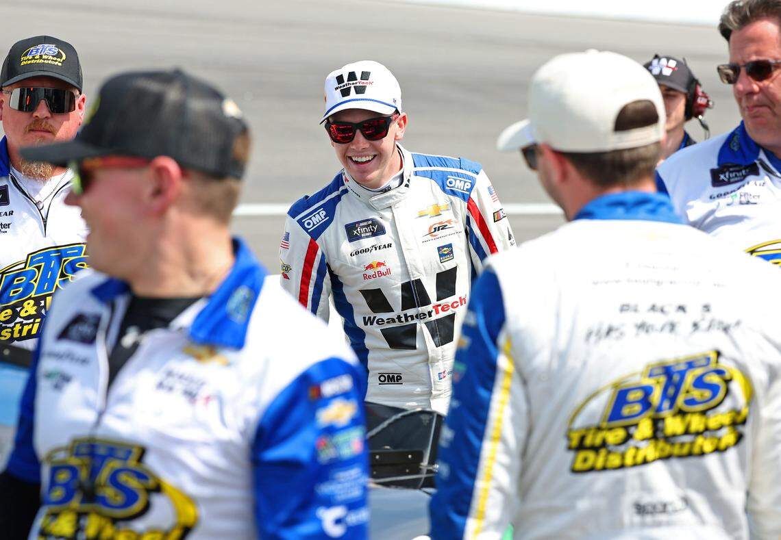 NASCAR Xfinity Series driver Connor Zilisch, center, jokes with another driver, right, prior to qualifying for the North Carolina Education Lottery 250 at Rockingham Speedway on Saturday, April 19, 2025.