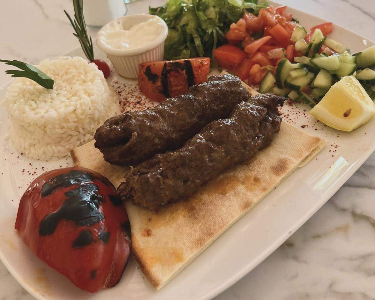 Adana kebab is a spiced ground beef and lamb blend. The kebab is grilled on skewers, offering a bold, smoky flavor.