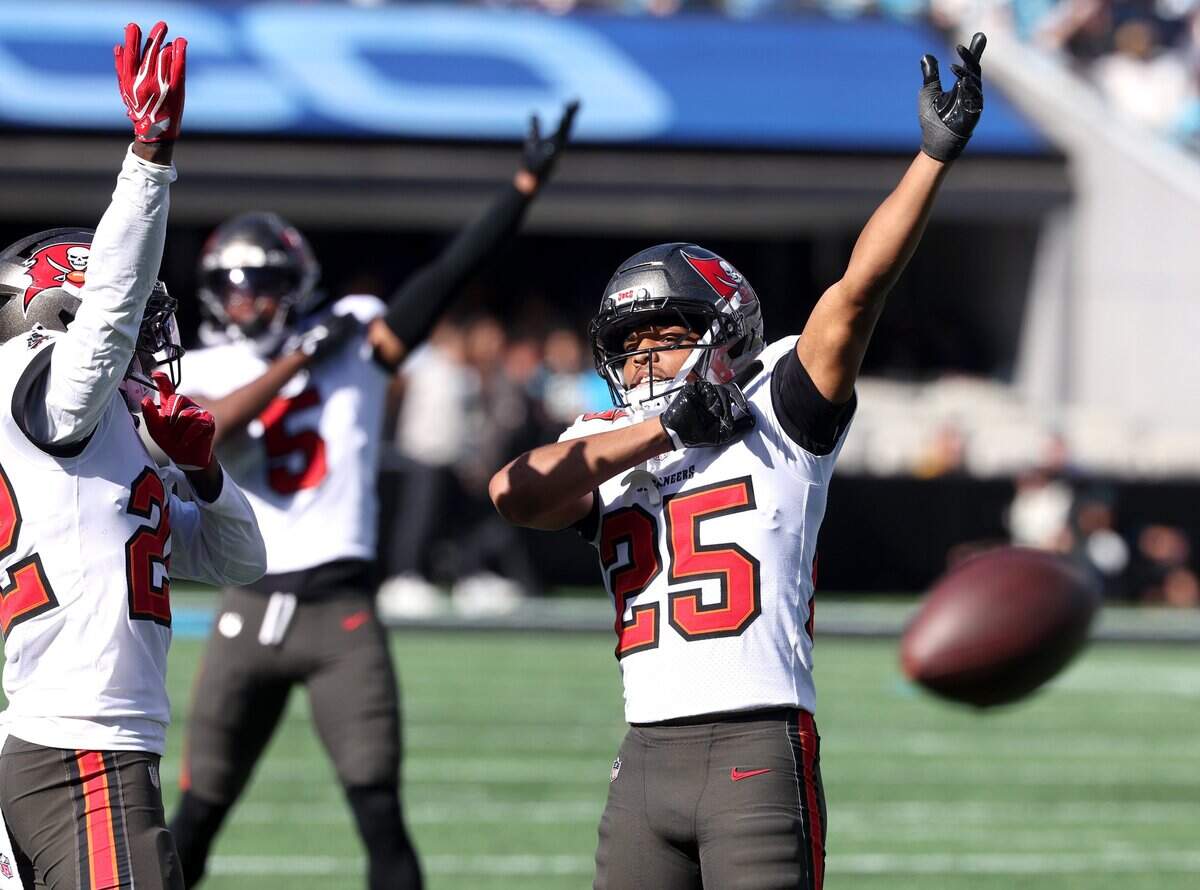Tampa Bay Buccaneers defensive back Keynote Scott, left, safety Ifeatu Melifonwu, center and cornerback Jacob Parrish, right, celebrate a stop of the Carolina Panthers offense during action at Bank of America Stadium in Charlotte, NC on Sunday, October 25, 2026.