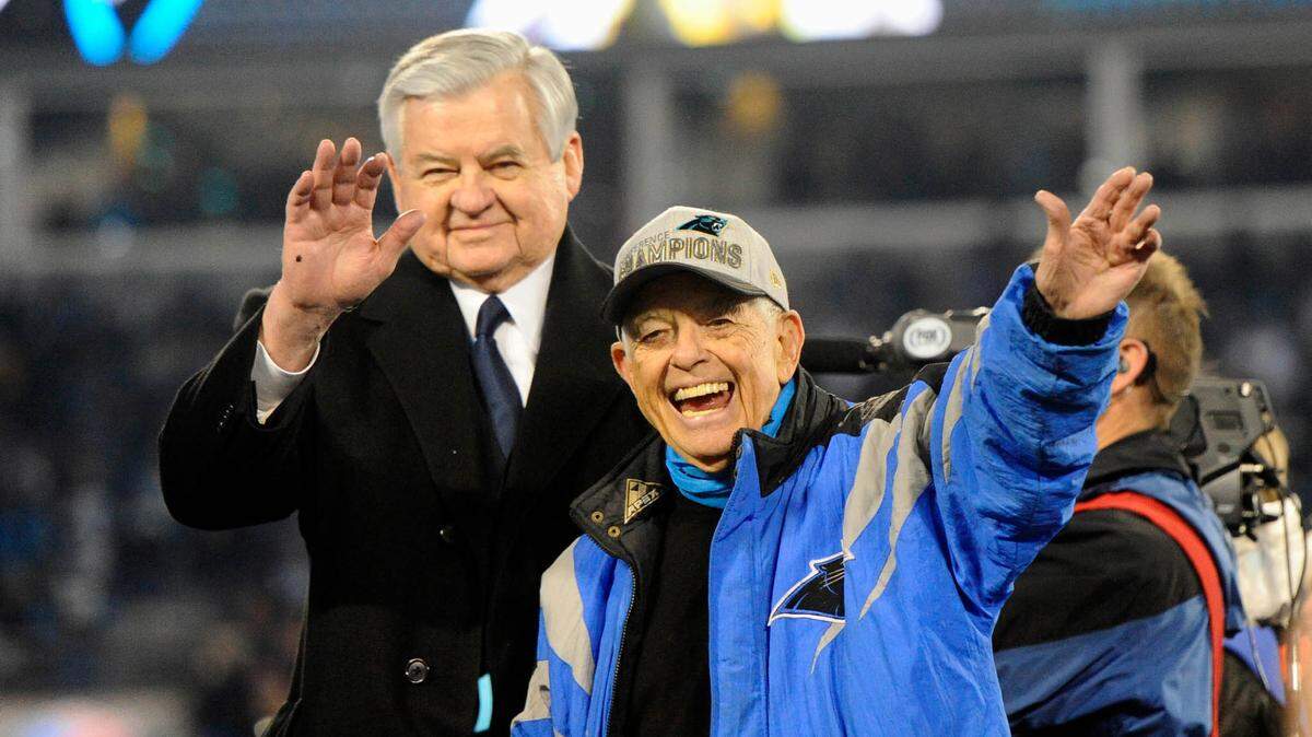 Carolina Panthers owner Jerry Richardson and his close friend, former Bank of America Chairman and CEO Hugh McColl Jr., wave to the crowd during the awards ceremony after the team defeated the Arizona Cardinals in the NFC Championship game at Bank of America Stadium in 2016 to advance to the Super Bowl. Richardson died earlier this month at age 86. His memorial service is Saturday in Spartanburg.