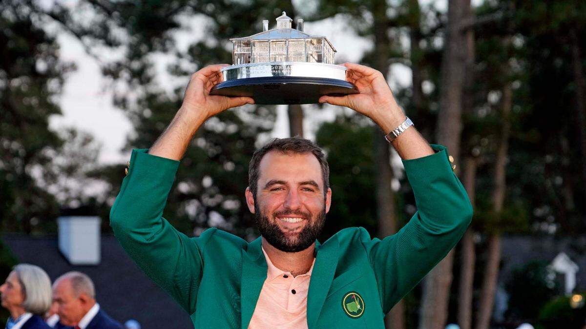 Scottie Scheffler poses with the Masters trophy after the final round of the 2024 Masters Tournament.