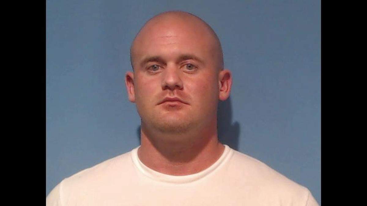 Raymond Heath Moore, a former detention officer, was fired Wednesday after officials accused him of smuggling drugs into the Rowan County Detention Center and giving them to inmates.