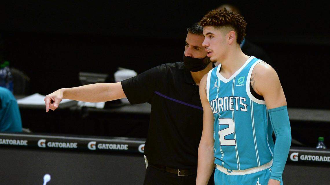 Charlotte Hornets coach James Borrego, left, saw growth in rookie LaMelo Ball, particularly before Ball’s wrist fracture. The summer will be important to Ball gaining strength and improving defensively.