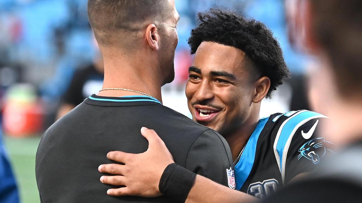 Carolina Panthers head coach Dave Canales, left, and quarterback Bryce Young, right, hug following the team’s 23-22 victory over the New Orleans Saints at Bank of America Stadium in Charlotte, NC on Sunday, November 3, 2024.
