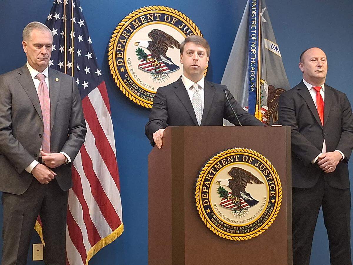 U.S. Attorney Russ Ferguson speaks at a news conference at his Charlotte office on Friday, Jan. 2, 2026, about the arrest of an 18-year-old from Mint Hill suspected of planning an ISIS-inspired terrorist attack. At Ferguson’s right is James Barnacle Jr., special agent in charge of the FBI in North Carolina. To Ferguson’s left is Mint Hill Police Chief Joseph Hatley.