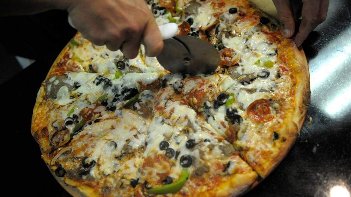 A West Virginia woman added a dose of ant poison to a man’s pizza out of jealousy, police say.