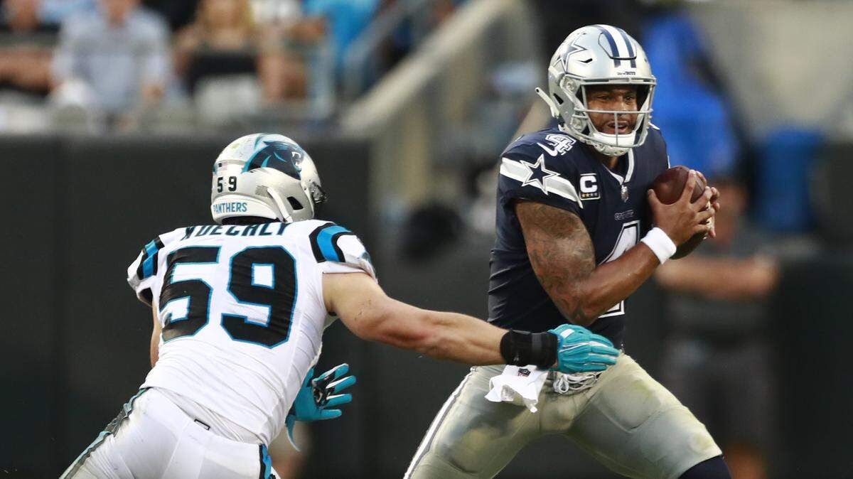 Carolina Panthers’ Luke Kuechly (59) was “just all over the place” in an 11-tackle game, including this pressure of Dallas Cowboys quarterback Dak Prescott.