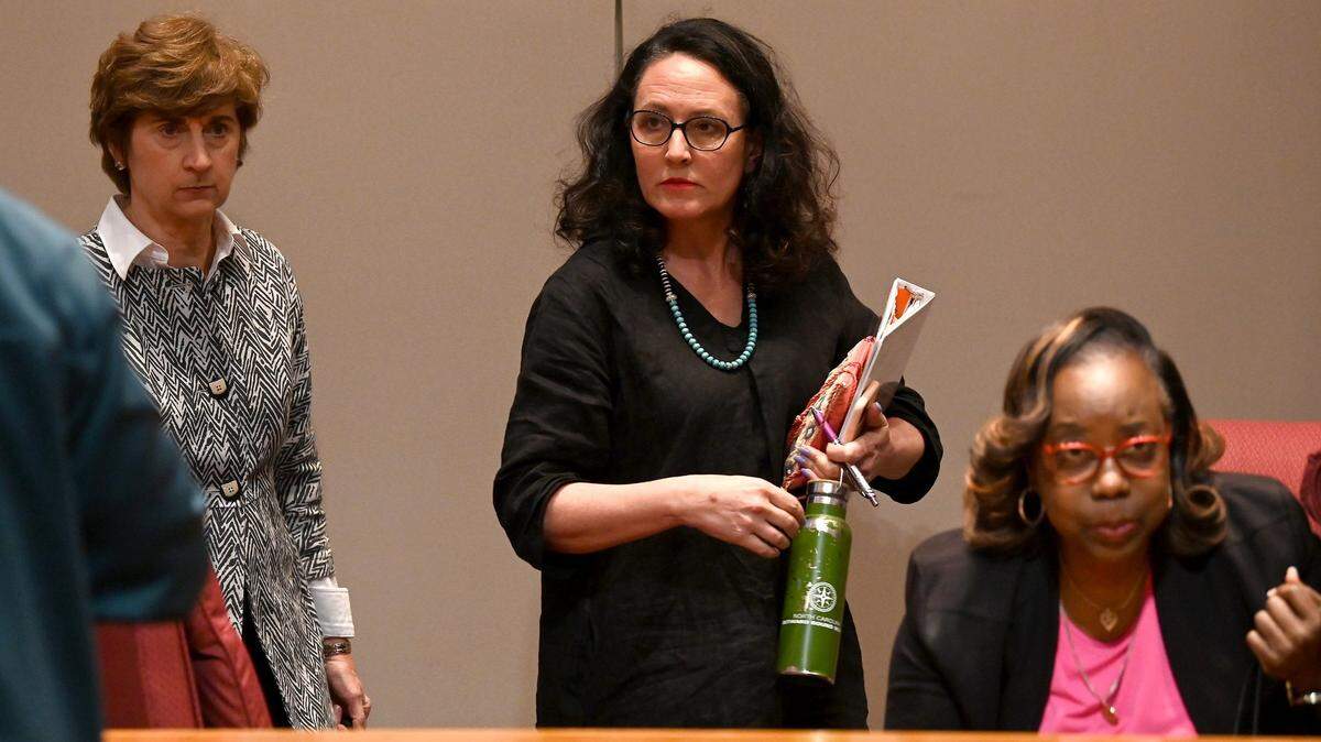 The Charlotte-Mecklenburg Board of Education Elyse Dashew, center, and board members leave for a closed session after 7-2 voted to terminate Superintendent Earnest Winston’s contract on Tuesday, April 19, 2022.