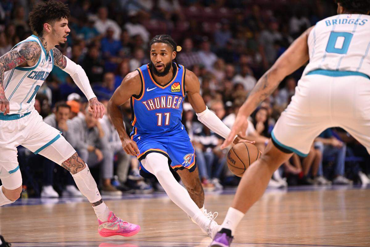 Oklahoma City Thunder guard Isaiah Joe (11) drives the paint against the Charlotte Hornets in the first quarter at North Charleston Coliseum. 