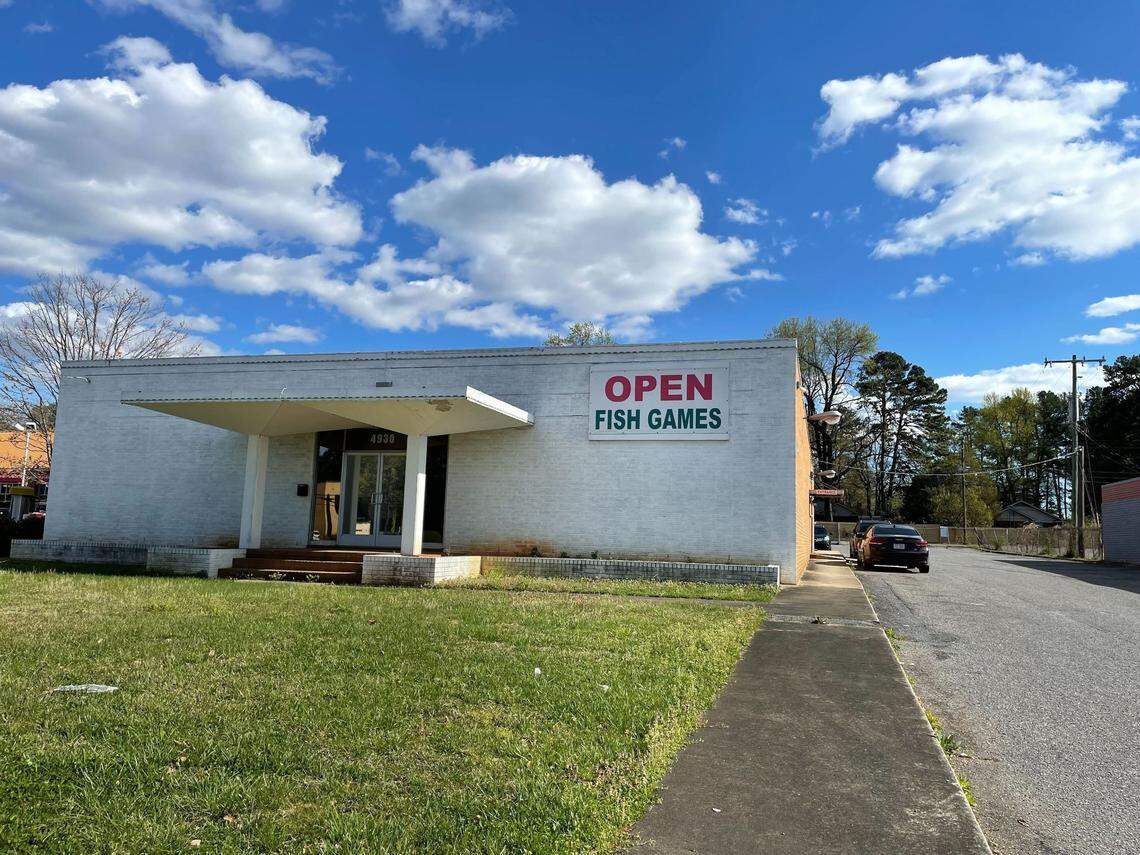 An open arcade sits on the along Albemarle Road near Pierson Drive in east Charlotte. A sign on the side door explains it is an “NFT trading facility,” not a sweepstakes or skill game facility, but a marquee along the street advertises fish games — the latest gambling craze police say is illegal.