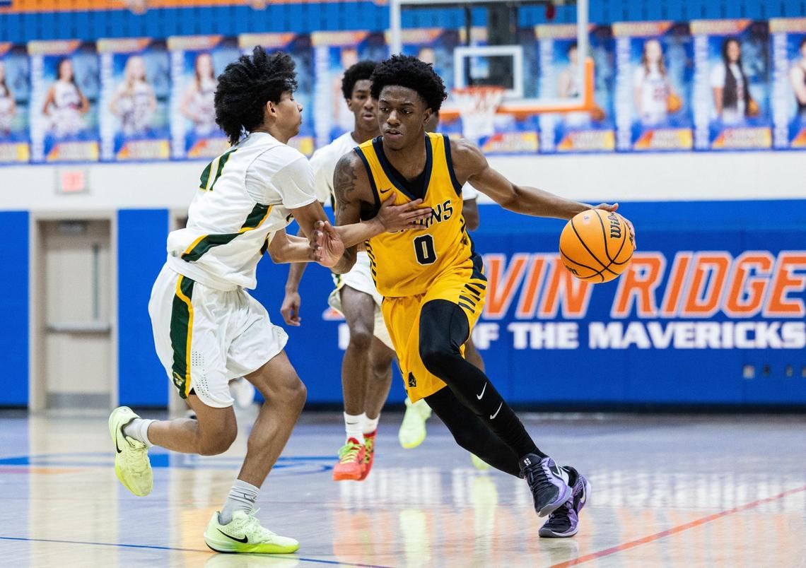 Lancaster Bruins Jordan Watford, right, drives past Independence Patriots Omarion Burgess during the Phenom Hoops New Year’s Bash at Marvin Ridge High School in Waxhaw, N.C., on Friday, December 27, 2024.