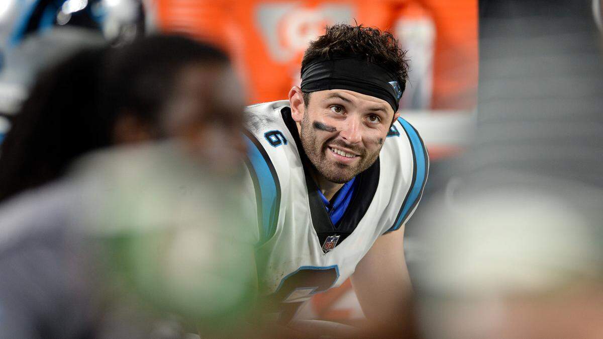 Carolina Panthers quarterback Baker Mayfield smiles as he sits on the team’s bench during action against the Buffalo Bills at Bank of America Stadium in Charlotte, NC on Friday, August 26, 2022.