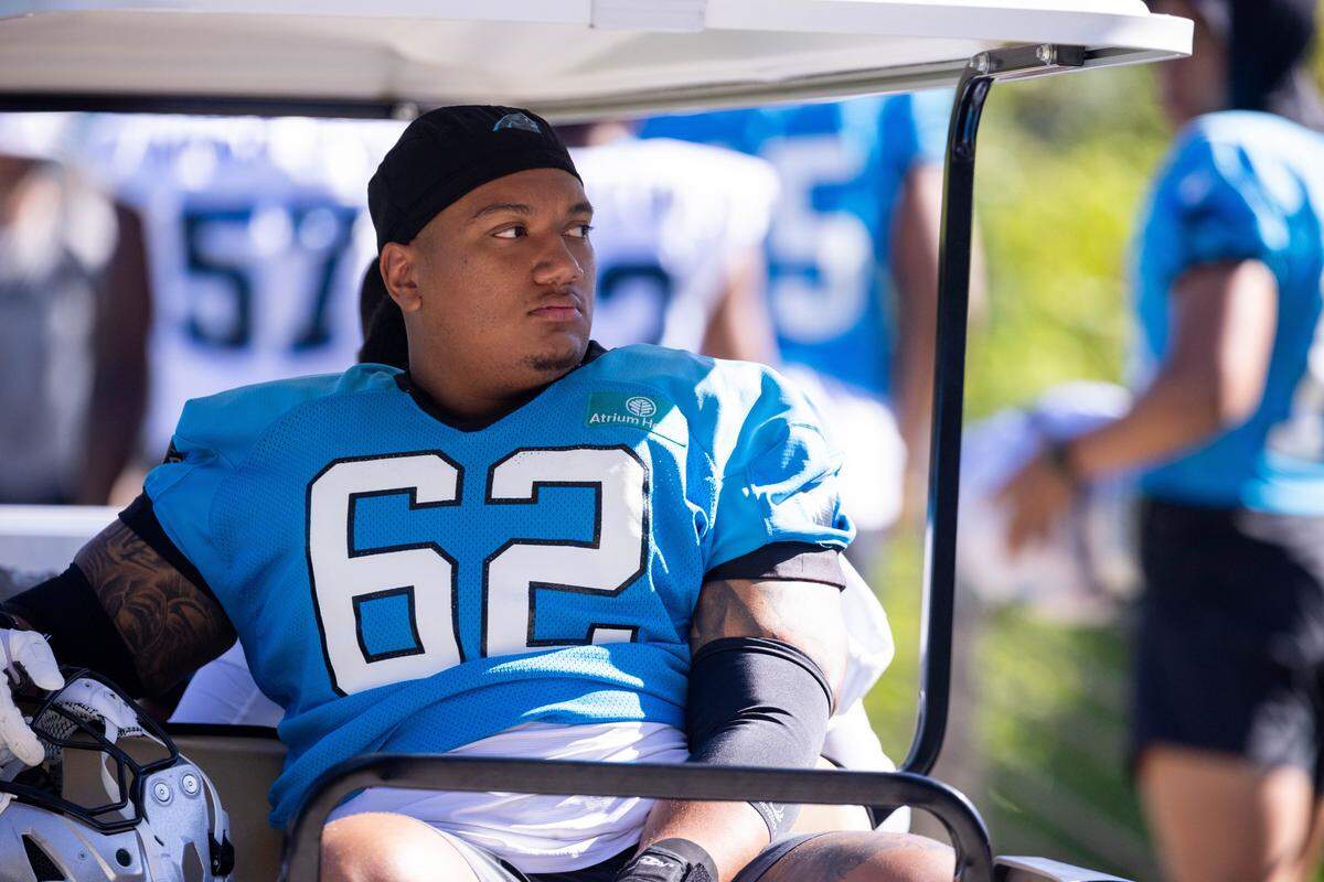 Carolina Panthers guard Chandler Zavala (62) rides up to a 2025 training camp practice.